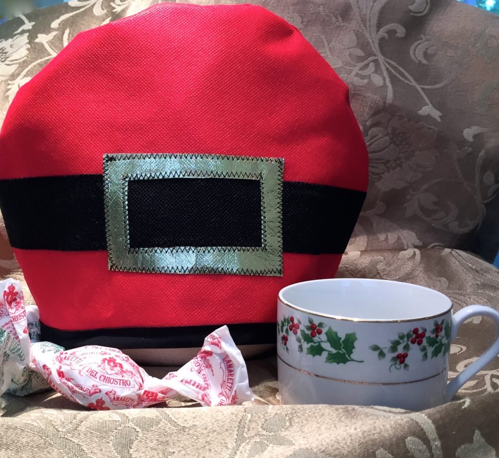 "H0-H0-H0 Santa's Holding the Tea pot warm"