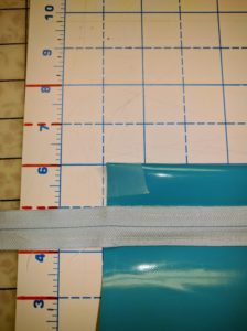1 inch mark on the cutting mat, pouch taped down with regular office tape. 1 inch mark on the cutting mat, pouch taped down with regular office tape.