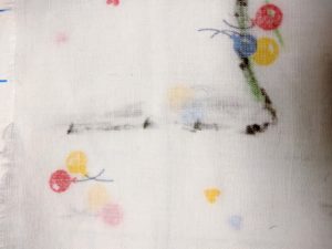 Two lines, one on each side of fabric