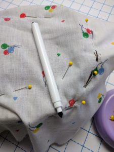 Once you've found all the seams use a water based marker and follow the pins, like follow the leader, only easier