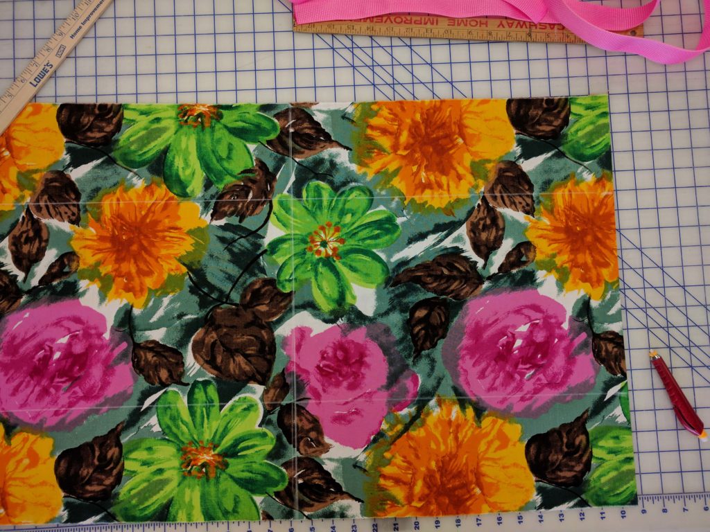 With chalk or a fabri pencil, mark lines down the center both horizontal and vertical